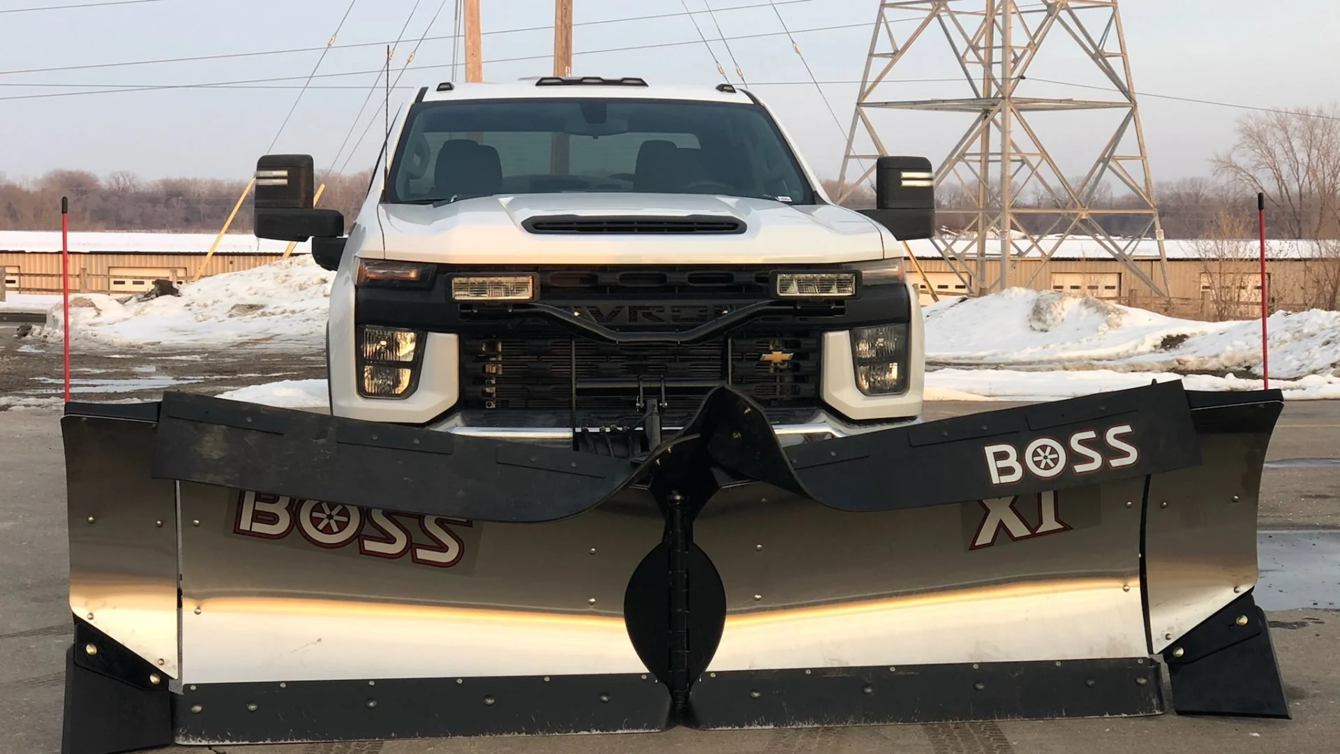 Commercial snow plow truck in commercial parking lot in Ankeny, IA.