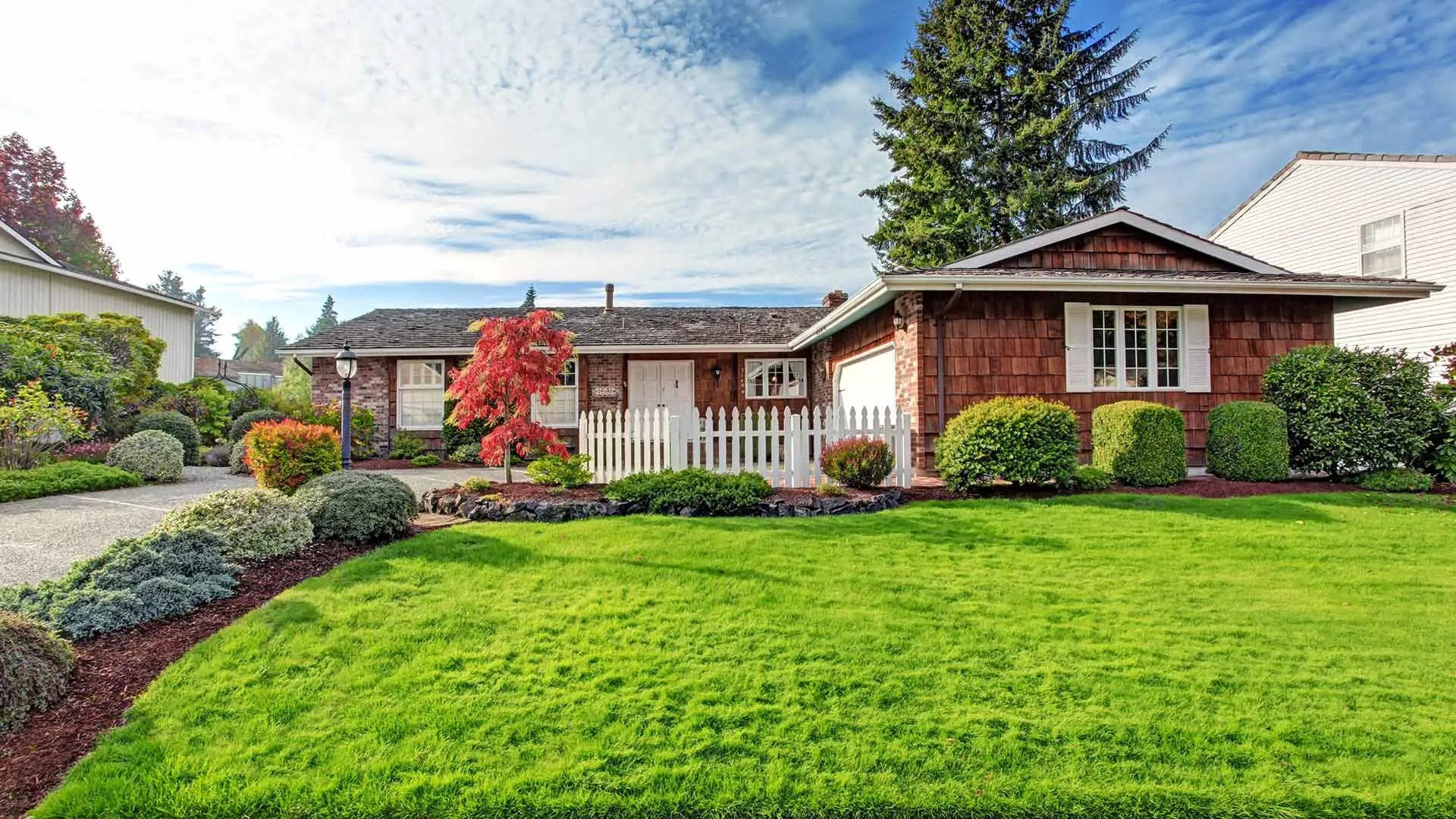 Gorgeous home with a healthy lawn and maintained landscaping in Polk County, IA.