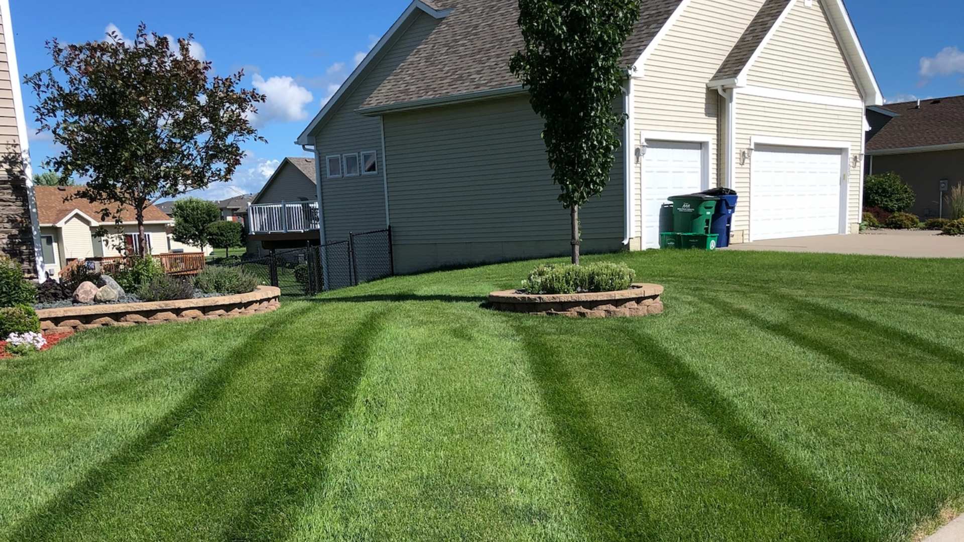 Mowed lawn with patterns added in diagonal direction in Urbandale, IA.