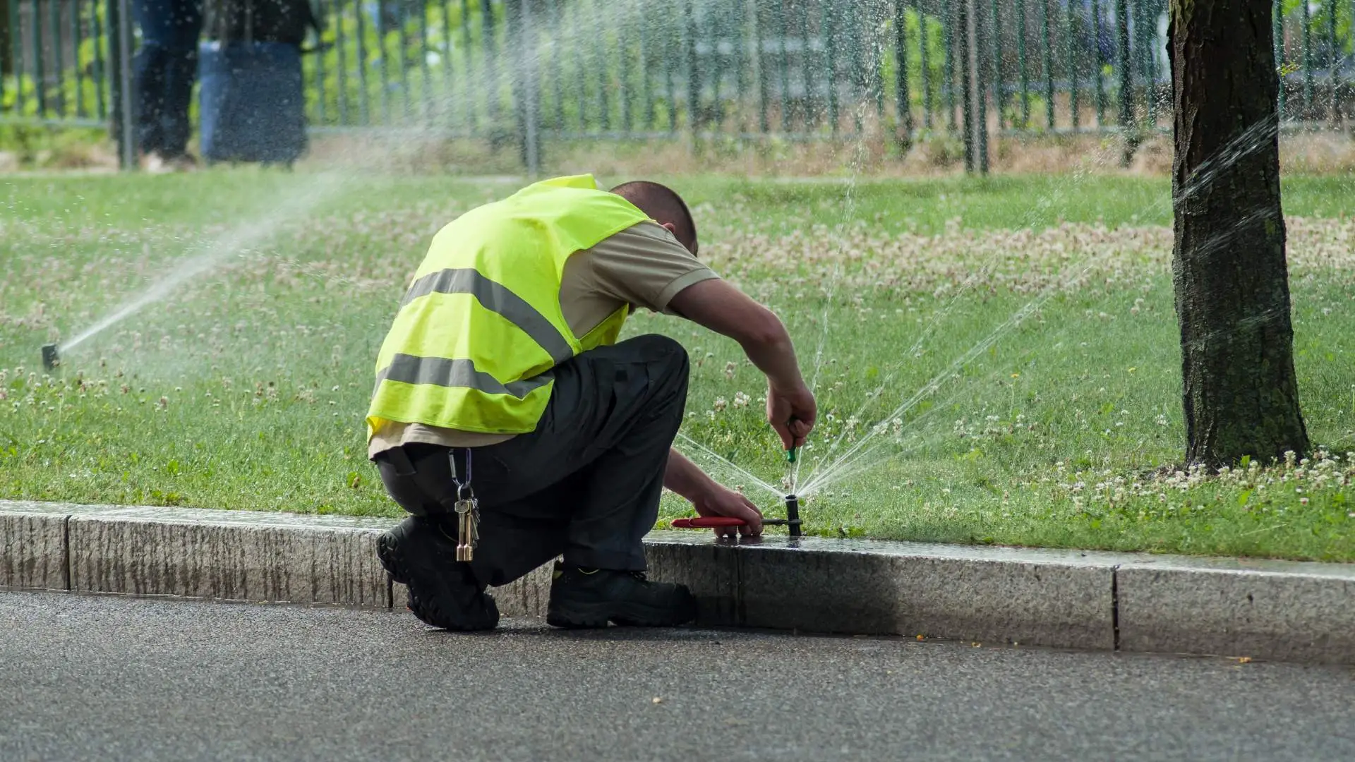 Professional repairing broken irrigation system in Urbandale, IA.