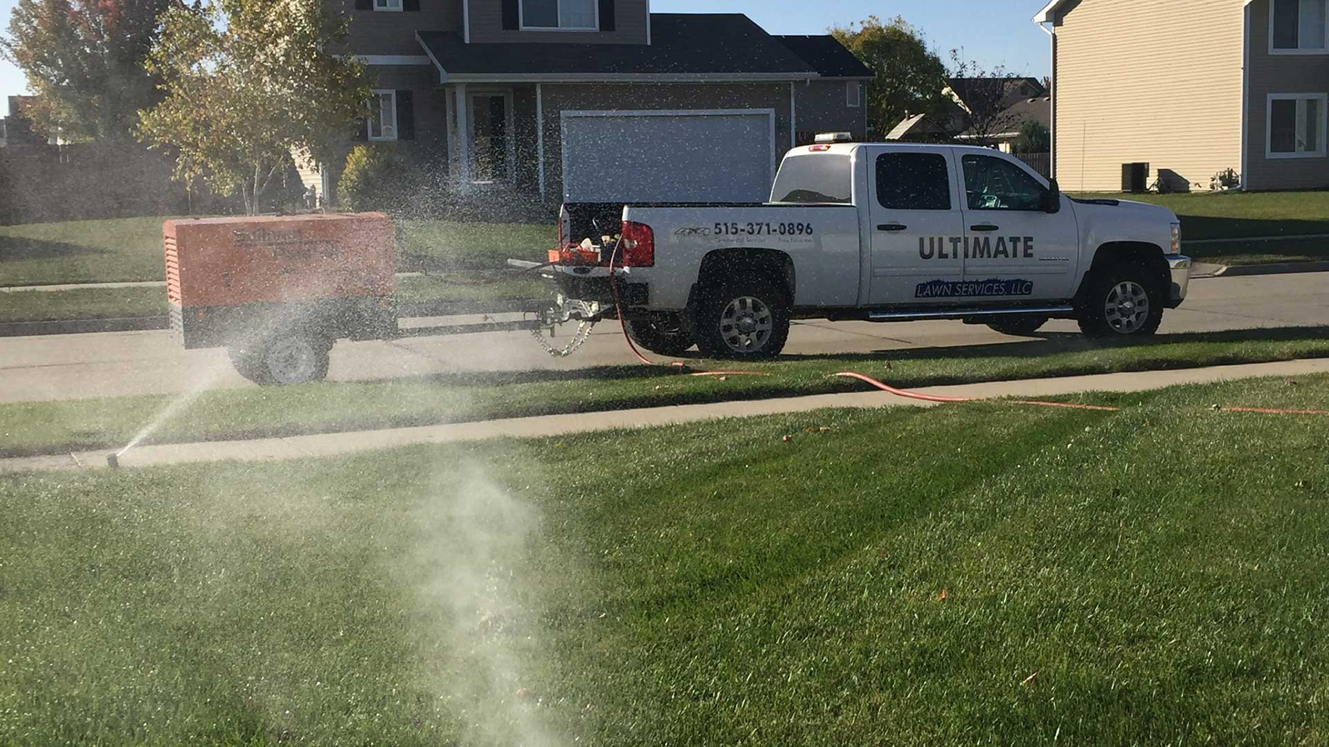 Ultimate Lawn Services work truck at a home in Urbandale, IA.