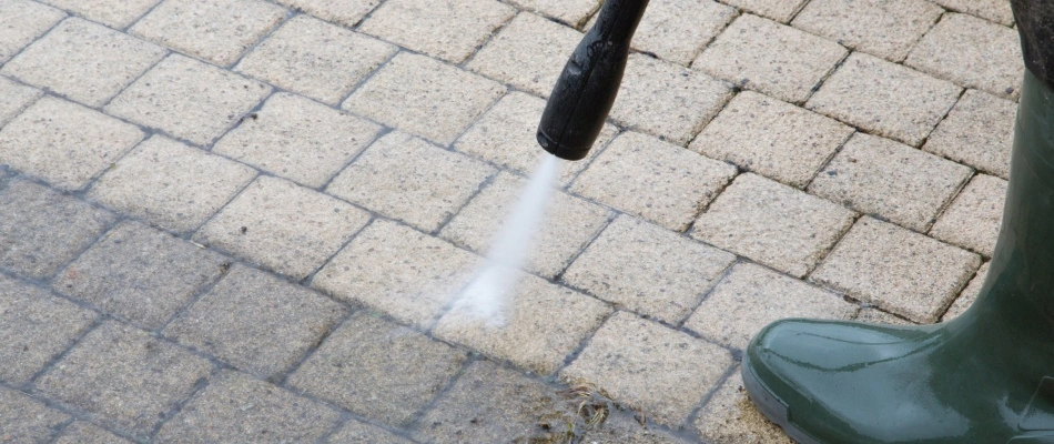 Cleaning pavers on patio in Urbandale, IA.