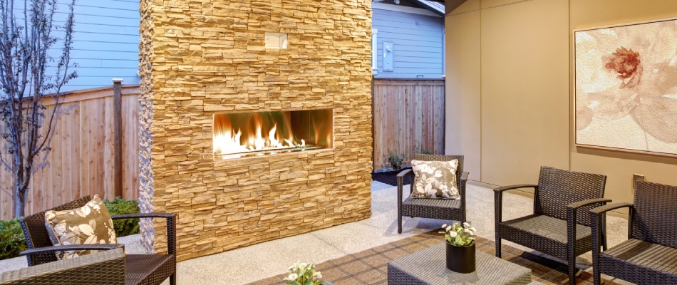Outdoor fireplace with patio area in Waukee, IA.