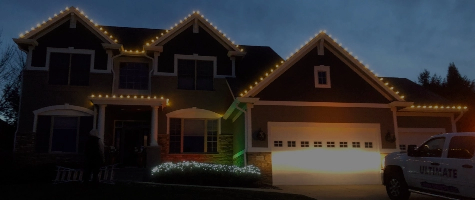Holiday lighting wrapped around home in Urbandale, IA.