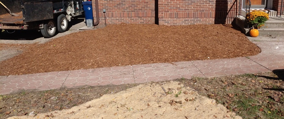 Mulch installed for landscape bed in front of home in West Des Moines, IA.