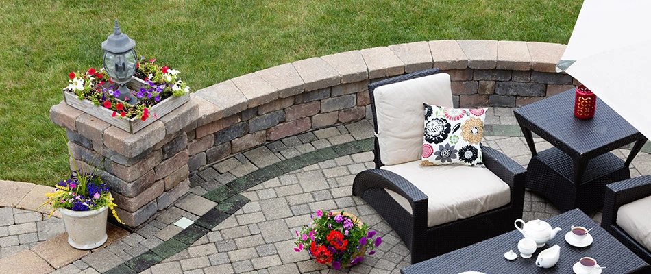 Hardscape seating wall along the edge of an elevated patio in and around the Clive, IA area.